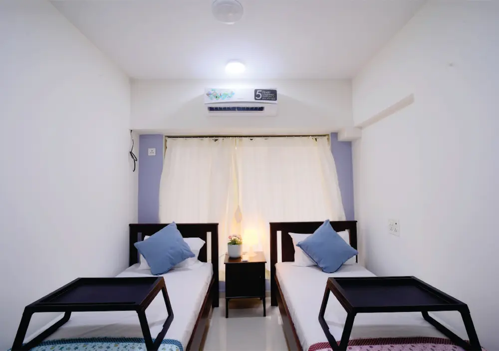 Twin bedroom interior at Monisha